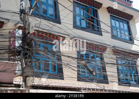 Messy electrical and communication cables tangled in kathmandu nepal Stock Photo