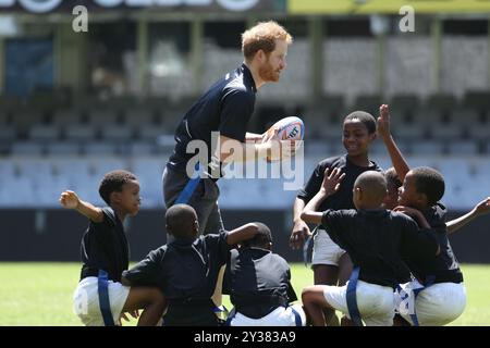 File photo of the Duke of Sussex at the age of 31. File photo dated 01/12/15 of Prince Harry playing tag rugby with children at Kings Park Stadium as he joins members of The Sharks rugby team on the pitch in Durban, in a training and skills sessions with coaches and young players as part of his visit to South Africa. The Duke of Sussex will celebrate his 40th birthday on Sunday. Issue date: Friday September 13, 2024. Stock Photo