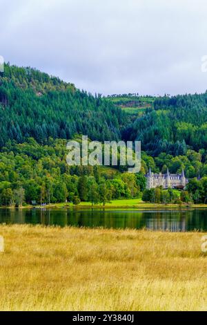 View of the Tigh Mor castle, and of Loch Achray, in Loch Lomond and the Trossachs National Park, Scotland, UK Stock Photo