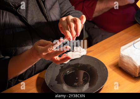 Tourists gold panning in Tankavaara Gold Village in Finland Stock Photo