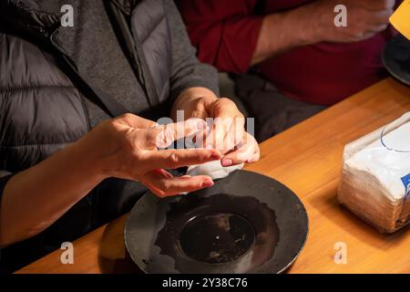 Tourists gold panning in Tankavaara Gold Village in Finland Stock Photo