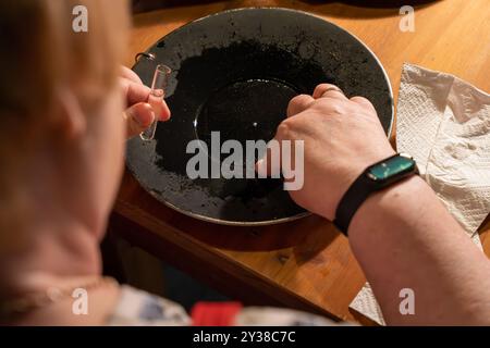 Tourists gold panning in Tankavaara Gold Village in Finland Stock Photo