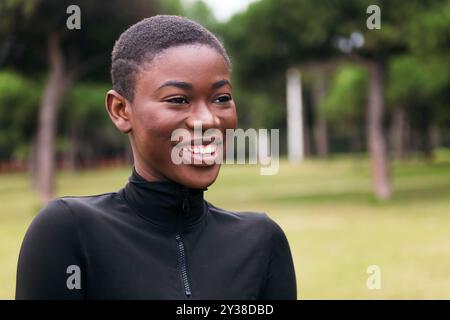 ethnic female with short hair smiling happy Stock Photo