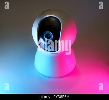 webcam security camera lens neon lights Stock Photo