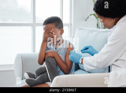 Sick, syringe and scared with child and medicine for consulting, helping and illness. Medical, healthcare and vaccine with boy and doctor in hospital Stock Photo