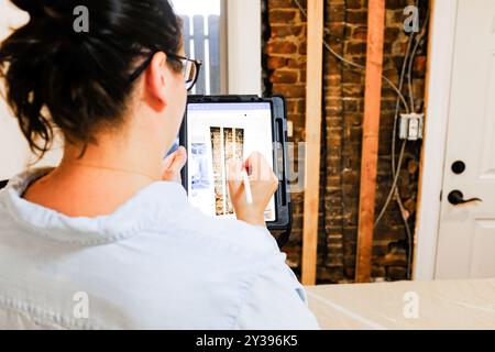 Architect Using Digital Tablet for Home Repair Stock Photo