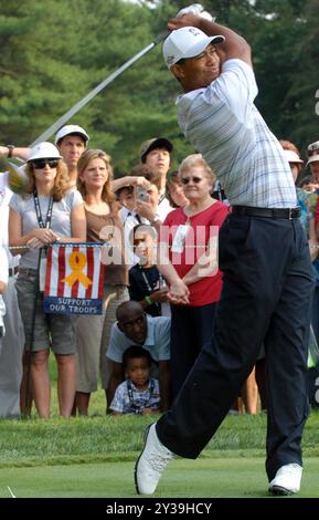 Tiger Woods, Champion Golfer, drives the ball down range during the inaugural Earl Woods Memorial Pro-Am Tournament, part of the AT&T National PGA Tour event, July 4, 2007, at the Congressional Country Club in Bethesda, MD.  Woods donated 30,000 tournament tickets to military personnel to attend the event honoring soldiers and military families. Defense Dept. photo by Petty Officer 2nd Class Molly A. Burgess, USN. Stock Photo