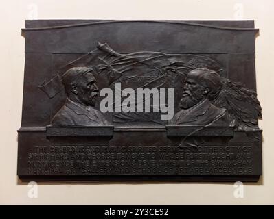 Memorial Tablet of Sir Richard and George Tangye, 1908. Situated on the stairwell in the entrance to the Birmingham Museum and Art Gallery, Chamberlain Square. Richard and George Tangye were engineering manufacturers, patrons of the arts and contributed a large sum to the building of the Museum &amp; Art Gallery, and the Birmingham School of Art on Margaret Street. Stock Photo