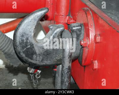 Coupling hook from an old steam locomotive painted black on red buffers Stock Photo