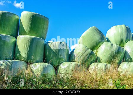 Pile of plastic wrapper straw bales falling over - Martizay, Indre (36), France. Stock Photo