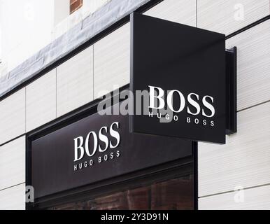 Leeds, west yorkshire, united kingdom, 7 july 2021: sign above the entrance of the hugo boss retail fashion store in leeds city centre Stock Photo