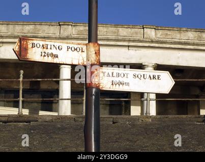 Old direction signs for the boating pool and talbot square on the pedestrian promenade in blackpool Stock Photo