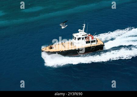 Nassau, Bahamas - April 15, 2008: a pilot boat navigates the waters near the Nassau Cruise Port Stock Photo