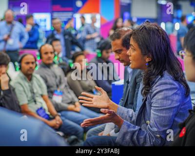 LOS ANGELES, CA- May 22, 2024: Female speaker interacting with diverse business audience in discussion session at Amazon Web Services  conference at A Stock Photo