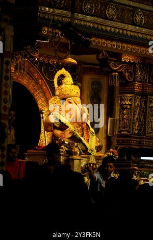 13 September 2024, Pune, Maharashtra, India, A huge crowd gathers to witness the grand Himachal Jatoli Shiva Temple replica created by the Dagdusheth Stock Photo