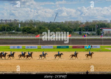 The Kazakh and Uzbek horse riders at kokpar (kok boru) game,  a traditional Asian sport competition, during World Nomad Games, Astana, Kazakhstan. Stock Photo