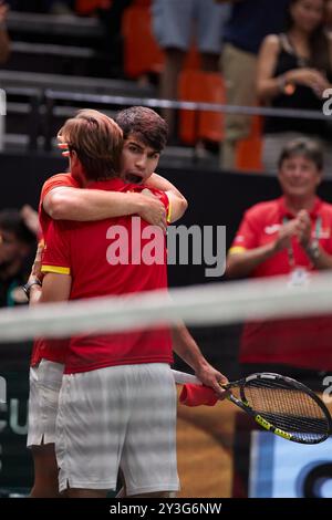 Valencia, Spain. 13th Sep, 2024. VALENCIA, SPAIN - SEPTEMBER 13: Carlos Alcaraz and David Ferrer captain of Spain celebrates after winning match point against Ugo Humbert of France during the Davis Cup Finals Group Stage 2024 Valencia match between France and Spain at Pabellon Fuente De San Luis on September 13, 2024 in Valencia, Spain. (Photo by Jose Torres/Photo Players Images/Magara Press) Credit: Magara Press SL/Alamy Live News Stock Photo