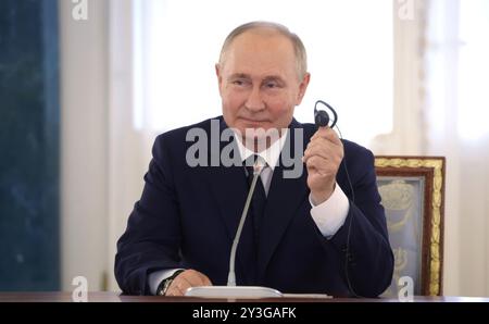 Strelna, Russia. 12th Sep, 2024. Russian President Vladimir Putin, smiles during a meeting with high-ranking BRICS officials responsible for security matters at the Constantine Palace, September 12, 2024 in Strelna, St Petersburg, Russia. Credit: Vyacheslav Prokofyev/Kremlin Pool/Alamy Live News Stock Photo