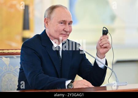 Strelna, Russia. 12th Sep, 2024. Russian President Vladimir Putin, smiles during a meeting with high-ranking BRICS officials responsible for security matters at the Constantine Palace, September 12, 2024 in Strelna, St Petersburg, Russia. Credit: Kristina Kormilitsyna/BRICS Pool/Alamy Live News Stock Photo