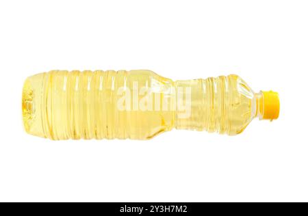Light yellow cooking or vegetable oil in small plastic bottle is isolated on white background with clipping path. Stock Photo