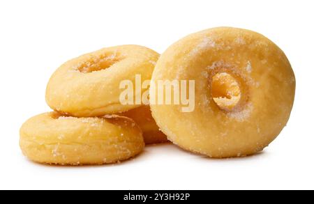 Side view of brown sugar glazed cinnamon donuts in stack is isolated on white background with clipping path. Stock Photo