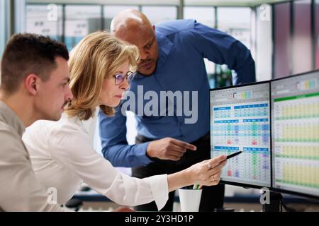 Analyst Employee Working On Spreadsheet Using Desktop Computer Stock Photo