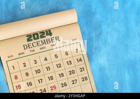 December 2024 calendar flat lay in blue background with copy space. Stock Photo