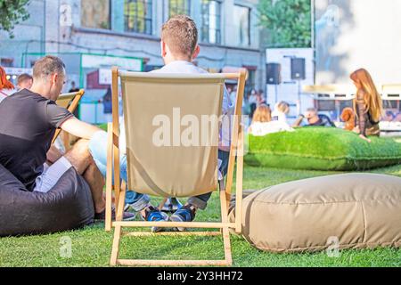 outdoor summer cinema with spectators and hookah on a sunny evening Stock Photo