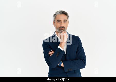 Portrait of serious middle aged business man thinking on business challenge. Stock Photo