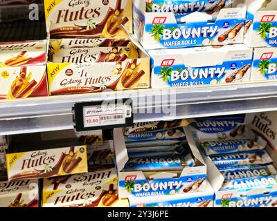 Cairo, Egypt, September 7 2024: Bounty is a coconut-filled, chocolate-enrobed candy bar manufactured by Mars, Incorporated, Galaxy is a chocolate bar, Stock Photo