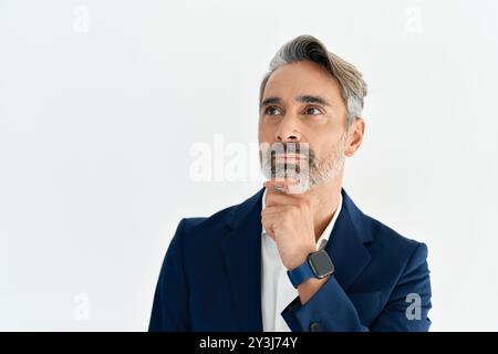Serious middle aged business man entrepreneur thinking on business challenge. Stock Photo