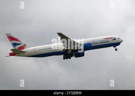 British Airways Boeing 777-200 Extended Range passenger airliner G-VIIU  takes off from Gatwick Airport in Southern England Stock Photo