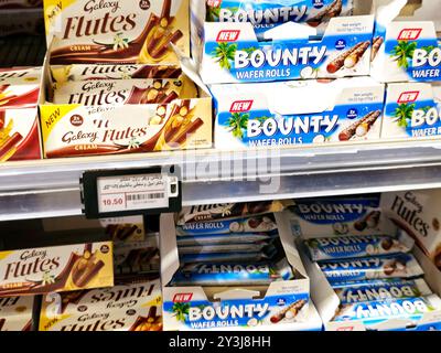 Cairo, Egypt, September 7 2024: Bounty is a coconut-filled, chocolate-enrobed candy bar manufactured by Mars, Incorporated, Galaxy is a chocolate bar, Stock Photo