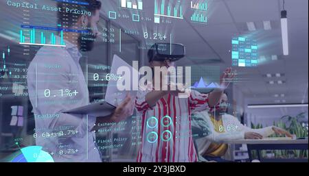 Image of diagrams and data processing over diverse colleagues using vr headset in office Stock Photo