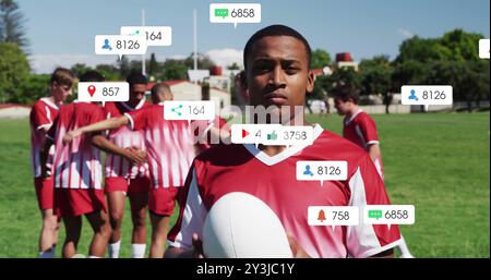 Image of icons and data processing over diverse rugby players Stock Photo
