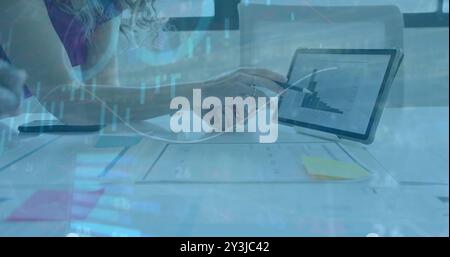 Financial data analysis image over person pointing at tablet with bar graph Stock Photo
