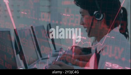 Image of financial data processing over asian businessman using phone headset and computer Stock Photo