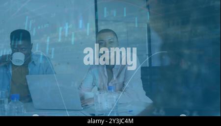 Financial data charts image over business people working in office Stock Photo