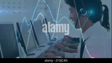 Image of financial data processing over asian businessman using phone headset and computer Stock Photo