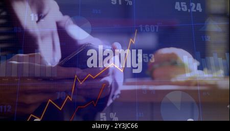 Image of data processing and diagrams over caucasian man using smartphone Stock Photo