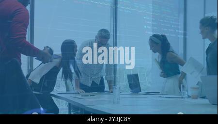 Image of financial data processing over diverse business people using laptop Stock Photo