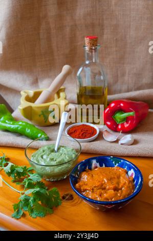 Mojo verde and mojo picon with ingredients. Canary Islands, Spain. Stock Photo