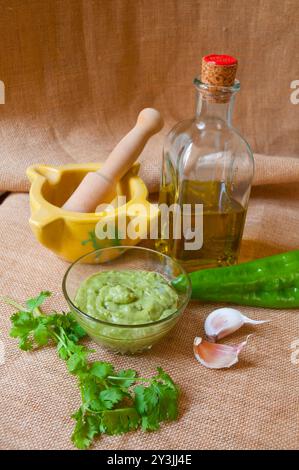 Green mojo with ingredients. Canary Islands, Spain. Stock Photo