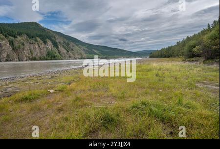 The Yukon River and Ogilvie Mountains with a distant view of Dawson City, Yukon, Canada Stock Photo