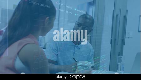 Business data charts image over diverse colleagues discussing in office Stock Photo