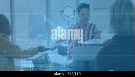 Image of financial data processing over diverse business people using laptop Stock Photo