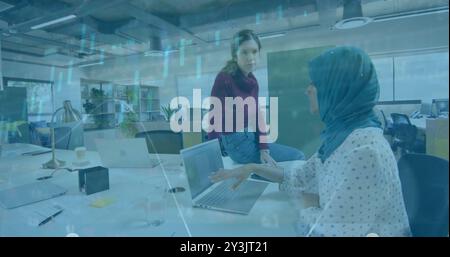 Image of financial data processing over diverse business people in office Stock Photo