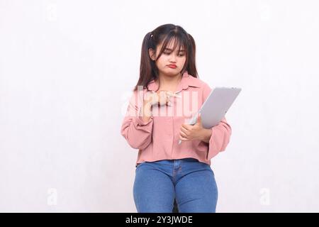 Business, finance and work Improvement projects successful asian businessman professional stylish frowning woman using laptop holding notebook pointin Stock Photo
