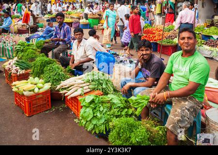 GOA, INDIA - APRIL 06, 2012: Unidentified vendors selling vegetables and salad at the local market in Goa in India Stock Photo