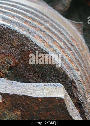 A close up of rusting brown steel machinery with rough texture and grooves Stock Photo